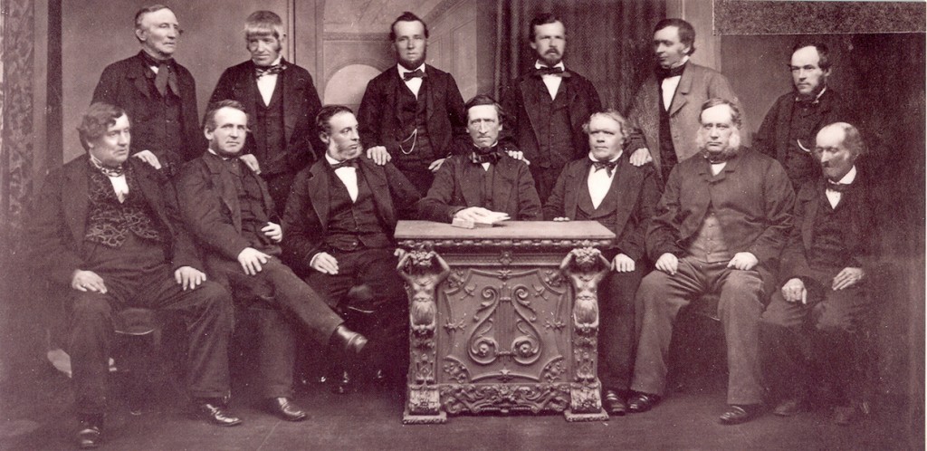 Rochdale co-operative pioneers' (1865) The first co-operative in the world was created in 1844 in Rochdale, Great Britain, by a group of people who set up a self-help community to address economic problems, such as finding reasonably priced food. Visit www.rochdalepioneersmuseum.coop for more information about Rochdale pioneers.