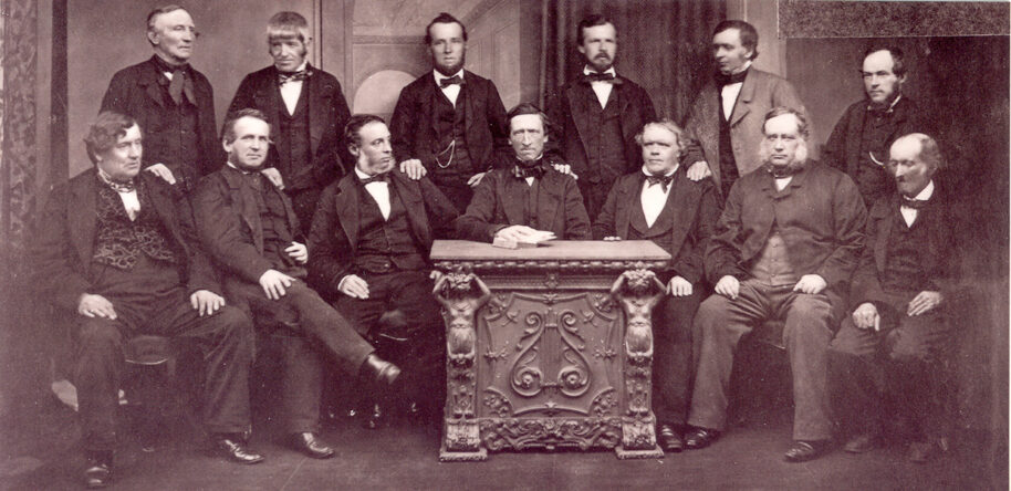 Rochdale co-operative pioneers' (1865) The first co-operative in the world was created in 1844 in Rochdale, Great Britain, by a group of people who set up a self-help community to address economic problems, such as finding reasonably priced food. Visit www.rochdalepioneersmuseum.coop for more information about Rochdale pioneers.