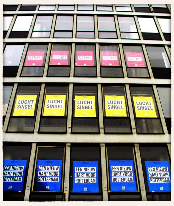 The posters promoting the proposal of Luchtsingel in the first of three stadsinitiatief (eng. city initiative) programs organized in Rotterdam in 2012 presented in the windows of the Schieblock. The Stadsinitiatief was a program of the municipality of Rotterdam where one project to improve the city was chosen through a public vote. The Luchtsingel was the first of the program’s winners. Image courtesy of ZUS.