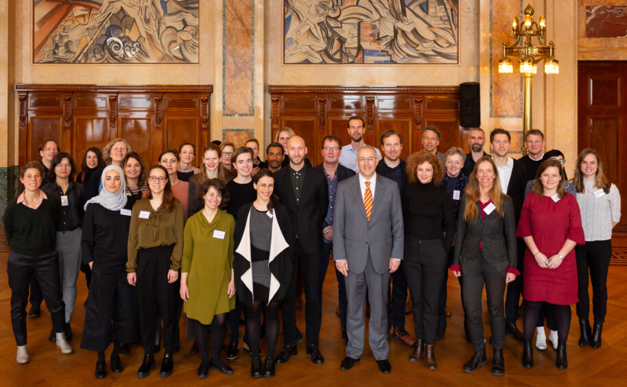 Group photo of contributors of Letters to the Mayor with the Mayor of Rotterdam Ahmed Aboutaleb.